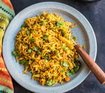 Veg Tawa Pulao - spicy, street-style rice tossed on a tawa with masalas, crunchy veggies, & butter.