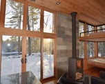 Cozy prefab modular tiny home interior with winter views.