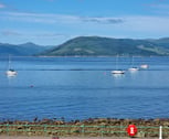 An image taken from a window a Gourock Seaview Holiday Let, with of boats in the water