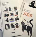 an illustrated calendar with black cats in different setups for every month of 2025