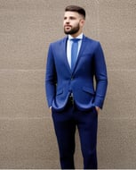 a man in a blue suit and tie