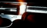 a person holding a gun in their hand