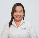 a woman in a white shirt and black pants