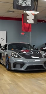 A porsche in the showroom of a dealership
