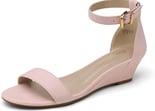 a woman's pink wedged sandal with a gold buckle