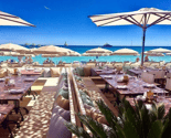 Beach in Cannes with restaurant and parasol