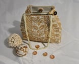 a purse bag with a beaded purse and shells