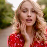 a woman in a red dress with a red dress