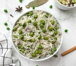 A fragrant rice dish bursting with sweet green peas, whole spices, and a touch of ghee.