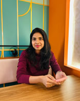 a gorgeous lady sitting in a cafe