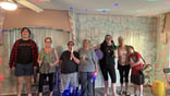 Bucket drum workshop group photo with everyone, smiling