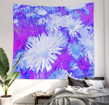Wall tapestry on wall with a daisy flower printed design on it, bed underneath. 