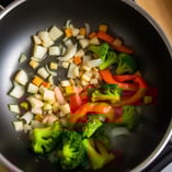 Sautéed onions, garlic, and ginger with broccoli and bell peppers