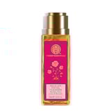a bottle of body lotion with a pink rose on it
