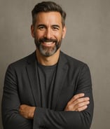 a man with a beard and a beard, smiling and wearing a suit