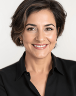 a woman with a black shirt and earrings