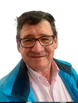 Portrait of a man in a red shirt and glasses