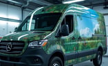 Custom designed floral themed commercial wrap on mercedes van