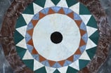 Acrylic painting including details of marble floor mosaic in shape of mandela 