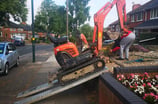 Mini digger being unloaded in Dudley for local excavation work