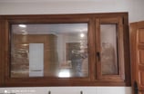 Ventana de madera de nogal con fijo.