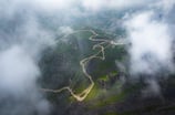 a mountain view of a winding road in the mountains. arbab naimat kasi Kalam