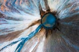 a blue and white flower with a blue sky.arbab naimat kasi balochistan Mud Valcano