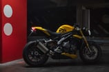 a yellow motorcycle parked in a parking lot