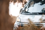 a vandalized van parked in a field