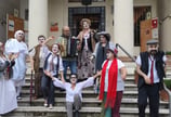 a group of people dressed in costumes for halloween