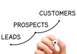 a person holding a pen and writing on a white board