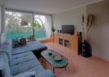a living room with a couch and a television