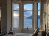 A large bedroom at Gourock Seaview Holiday Let with a view of the sea
