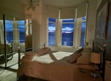 A large bedroom at Gourock Seaview Holiday Let with a view of the sea