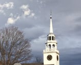 Norwich Congregational Church clock tower Vermont cloudy skies