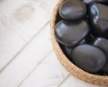 Full body hot stone massage for deep relaxation during Ballarat Winter Festival 2025 – warm winter t