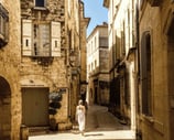 Woman walking in Provence village streets Saint Remy de Provence