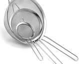 a metal strainer with a mesh strainer and a strainer