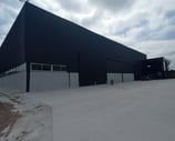 a large building with a large black building in the background