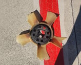 Broken cooling fan on ground