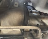 Starter motor inside a vehicle engine
