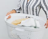 woman holding a laundry basket