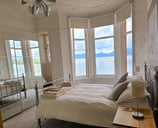 A large bedroom at Gourock Seaview Holiday Let with a view of the sea