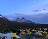 A tent pitched up in Paine Grande campsite with Cerro Cuerno Principal 