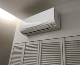 a white air conditioner with a white air conditioner