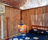 a bed with a blue bedding and a wooden bed