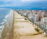 a beach with a view of a city