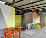 Modern dining room with veg food and comfortable seating