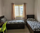 Cozy and Modern twin-sharing room.