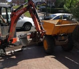 Dumper moving spoil on small site in Dudley
